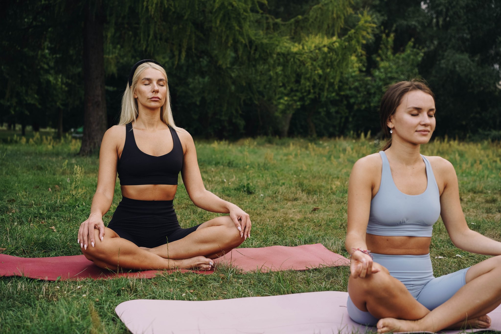 two-women-meditating-on-yoga-mats