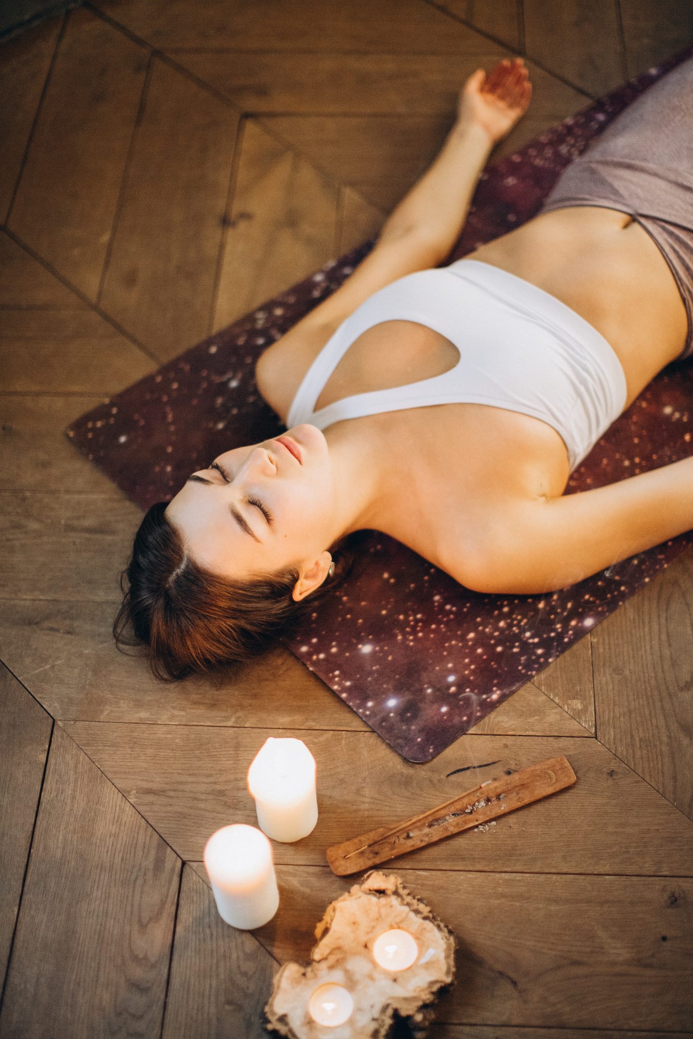 woman-relaxing-in-yoga-mat